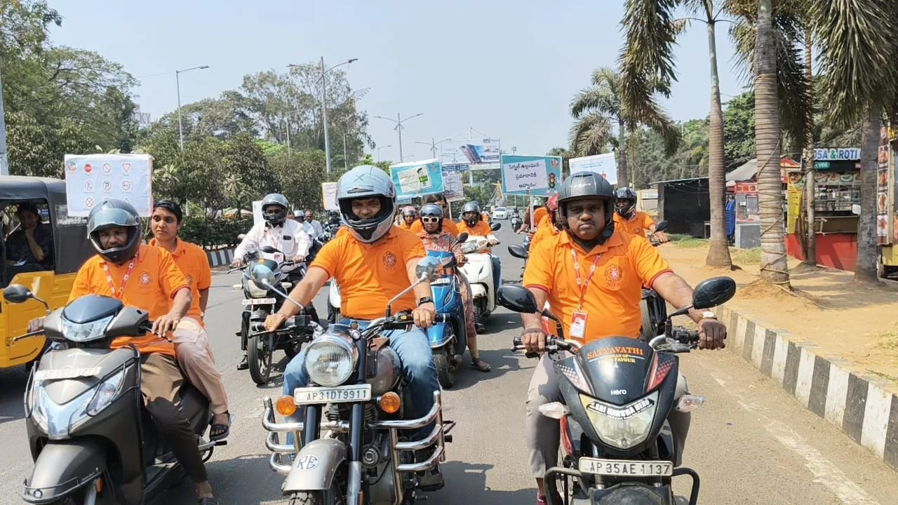 Road safety awareness motorcycle rally with riders in orange shirts
